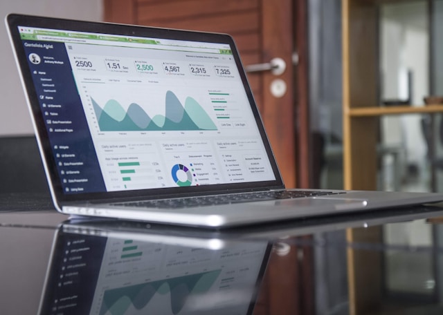 Dashboard interface showing analytics graphs and charts on a laptop screen